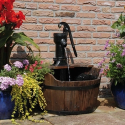 An addition to the garden is a wooden Ubbink water barrel