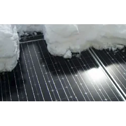 Photovoltaic panel defrosting system